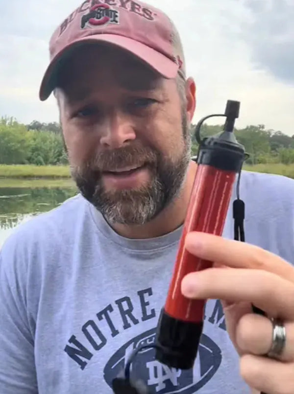 Customer holding the water filter straw